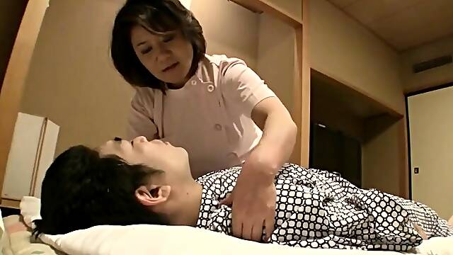 Japanese amateur MILF sucking on dick