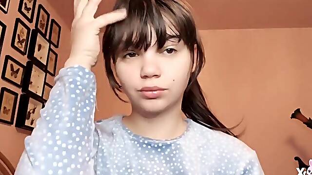 Brunette hair with natural large lips with natural color lipgloss smokin' a cigarette blowing smoke in your face